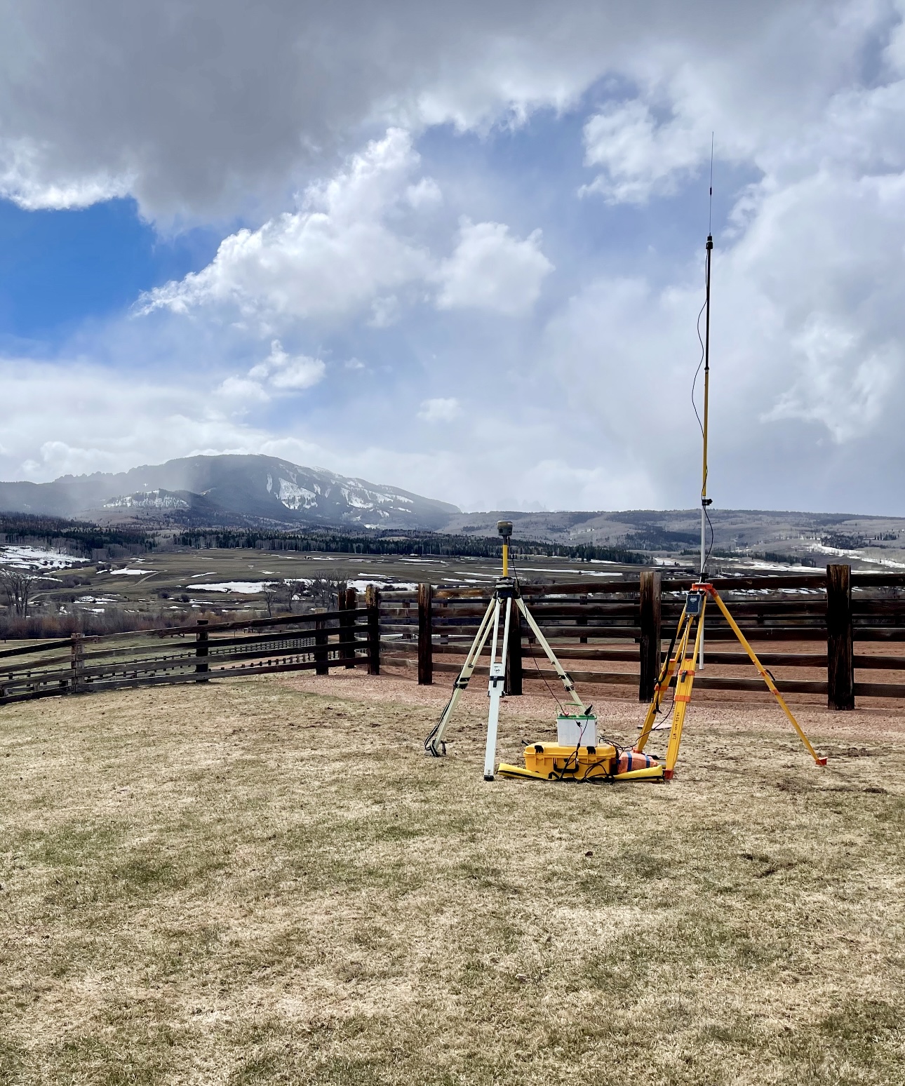 A field with some poles and a camera