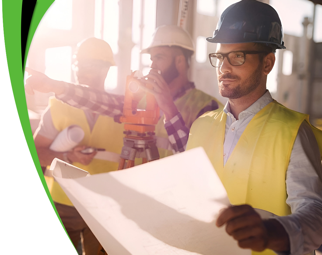 A group of construction workers looking at plans.